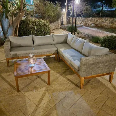 a couch and a coffee table on a patio at Paradisos Villa - Chania, Crete in Litsárdha