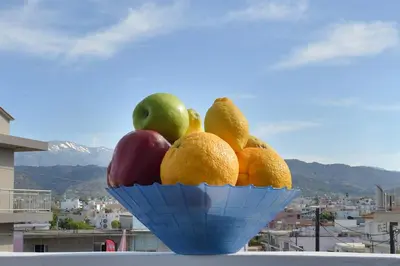 a bowl of fruit sitting on top of a balcony at Gavalas Urban Home in Chania Town