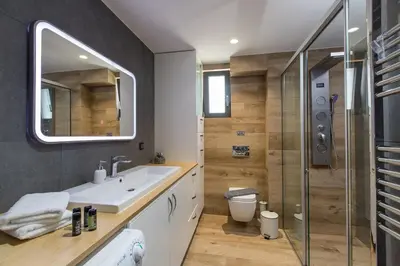 a bathroom with a sink and a shower at Casa Galatas in Galatás