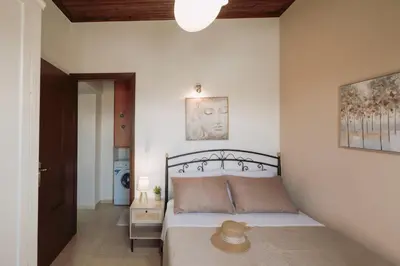 a bedroom with a bed with a hat on it at The Morus House with Private pool in Melidhónion