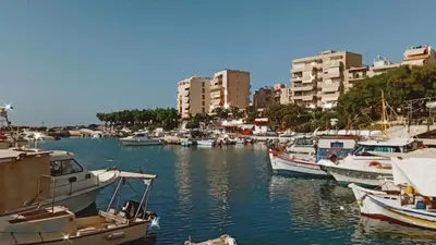 a group of boats docked in a harbor with buildings at Avanti Chania Luxury Apartment in Chania Town