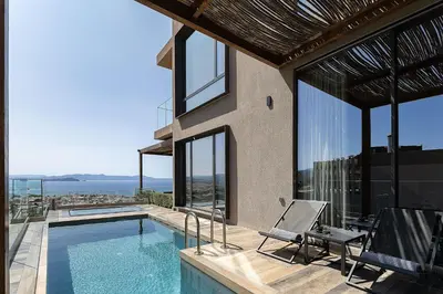 a house with a swimming pool with a view at Omma Villas in Chania Town
