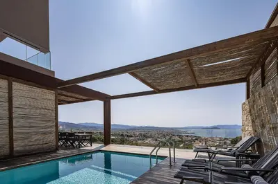 a house with a swimming pool with a view at Omma Villas in Chania Town