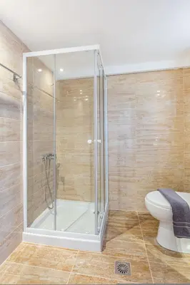 a glass shower in a bathroom with a toilet at Neva's Apartment's in Center Chania 1 2 in Chania Town