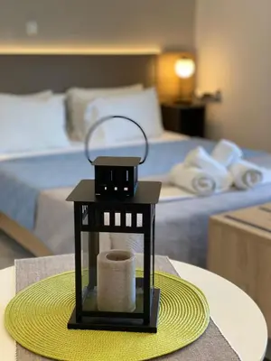 a table with a toilet paper dispenser on a table in a hotel room at Stelios Studios Sougia in Sougia