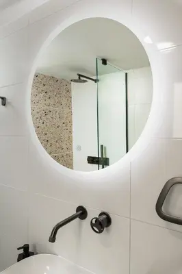 a bathroom with a mirror and a sink at Michalis NCHouse 33 in Chania Town