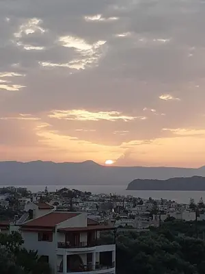 a view of a city at sunset at Anestis Ioanna Villa in Daratso