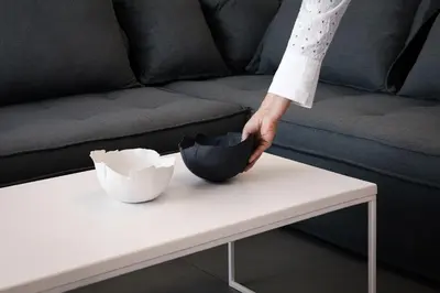 a person is standing on a white coffee table at Hermes&Dione in Argoulidhés