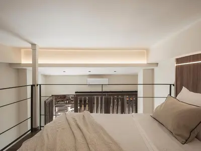 a bedroom with a bed and a balcony at Copal Experience The Port in Chania Town