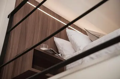 a view of a bed in a room at Copal Experience The Port in Chania Town
