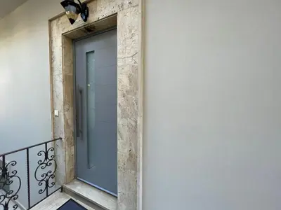 a glass door on the side of a building at The Nest of Urban Living by 8essentially in Chania Town