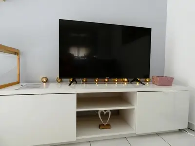 a white entertainment center with a television on it at Mel Studio 1 (kalamaki) in Kalamaki Chanion
