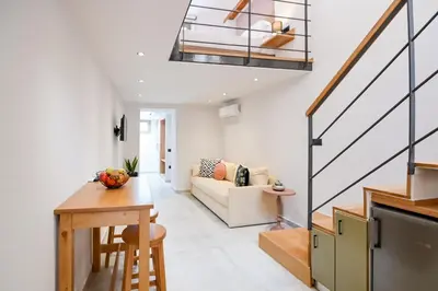 a living room with a couch and a table at Nem Home, amazing 1 bedroom house in Chania Town