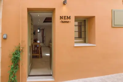 a new home sign on the side of a building at Nem Home, amazing 1 bedroom house in Chania Town