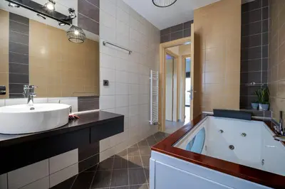a bathroom with a tub and a sink at Fotini 's apartment near the city center. in Chania Town