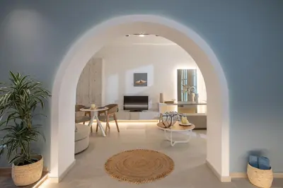 an archway in a living room with a couch and a table at Casa Blue Dove in Chania Town