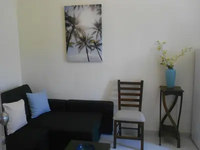 a living room with a couch and a chair at Domus Nicola in Chania Town
