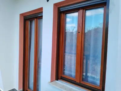 three windows on the side of a building at Domus Nicola in Chania Town