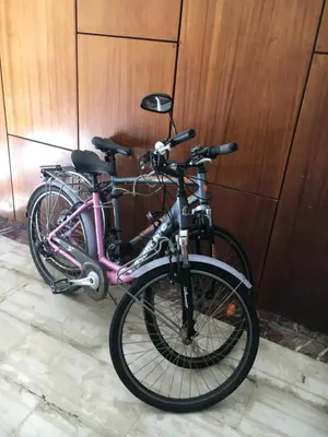 a pink bike parked next to a wooden wall at At the Beach! +10min= port&center. in Chania Town