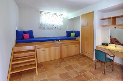 a bathroom with a blue bench with a sink and a desk at Beachfront villa Aqua Marine with private pool,ping-pong & BBQ in Chania Town