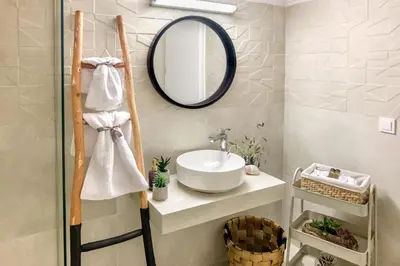 a bathroom with a sink and a mirror at Casa In Centro Chania in Chania Town