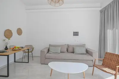 a living room with a couch and a table at Moka Apartments in Chania Town