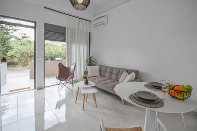 a living room with a couch and a table at Moka Apartments in Chania Town