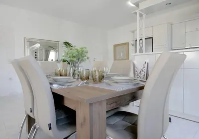 a dining room with a wooden table and chairs at Premium, 2-bedroom Apartment! in Chania Town