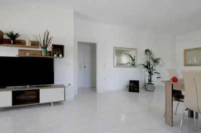 a living room with a large flat screen tv at Premium, 2-bedroom Apartment! in Chania Town