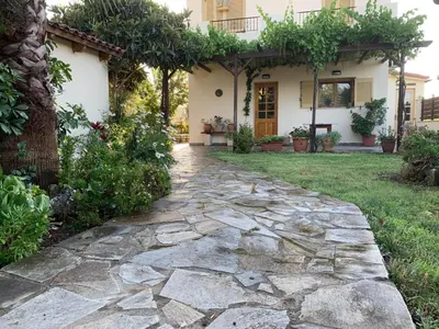 a stone walkway in front of a house at VILLA FATIMA in Vryses