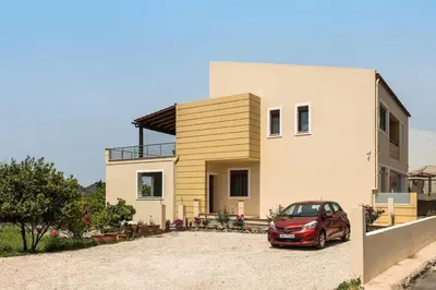 a car parked in front of a house at Luxury Katsoulakis Apartments in countryside in Alikianós