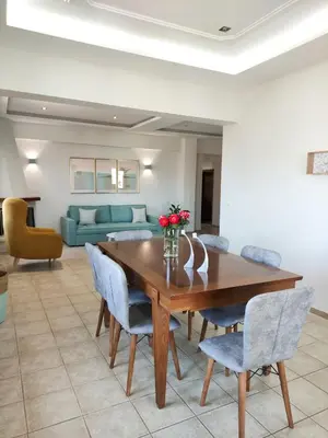 a dining room with a wooden table and chairs at Rastoni Chania - Guests Apartment in Chania Town