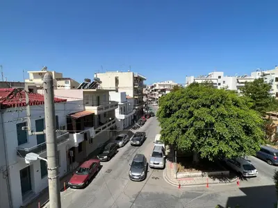 a city street with cars parked on the street at Antonis Kavros appartment in the center of chania in Chania Town