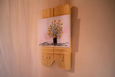 a painting of a vase with flowers on a wall at villa archontiko ASKYFOU SFAKIA in Karés