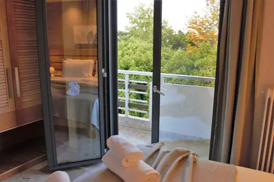 a room with a glass door leading to a balcony at koukounari apartment in Chania city center in Chania Town