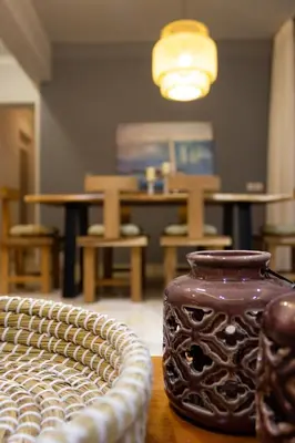 a vase sitting on top of a wooden table at koukounari apartment in Chania city center in Chania Town