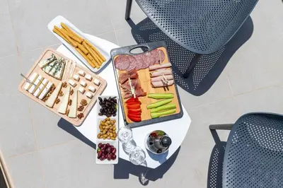 a table with a tray of different types of food at Mansion Fabrica in Kalleryianá