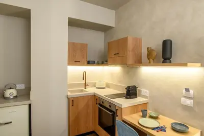 a small kitchen with a sink and a stove at Casbah Boutique Hotel in Palaiochóra
