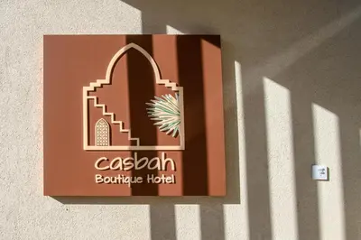 a sign on the side of a building at Casbah Boutique Hotel in Palaiochóra