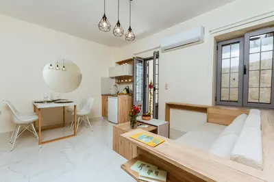 a living room with a couch and a table at Emeli Suites in Chania Town