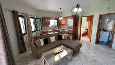 a living room with a couch and a table at Eteá Urban Nest living In the Heart of Chania in Chania Town