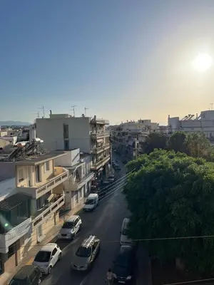 a city street with cars parked on the road at Eteá Urban Nest living In the Heart of Chania in Chania Town