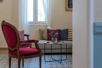 a living room with two chairs and a table with a couch at Villa Remedio in Néon Khoríon
