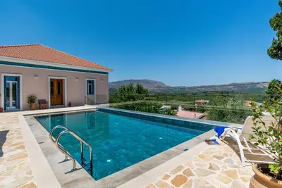 a swimming pool in a villa with a view at Villa Remedio in Néon Khoríon