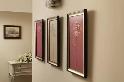 a group of four pictures hanging on a wall at Nobili Boutique Hotel in Chania Town