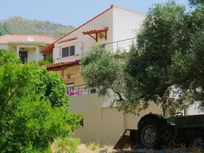 a house with a car parked in front of it at Katerina's house in Kefálion