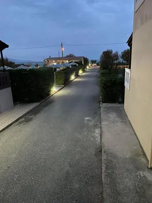 an empty street with lights on the side of a house at Livadia Studios in Ropanianá