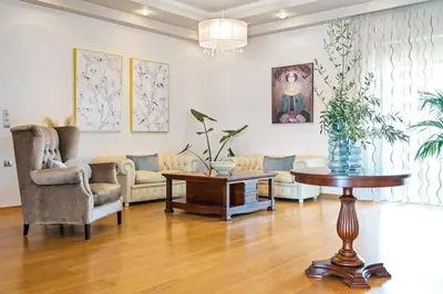 a living room with a couch and a table at Villa Anastasia with private heated pool and privacy in Chania Town