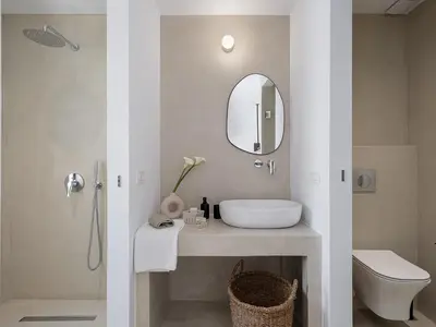 a bathroom with a sink and a mirror at Lithos Retreat 2(ΛΙTHOS Retreat) in Kolymvari