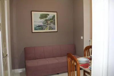 a living room with a couch and a table at Kissamos Nice Apartment2 in Kissamos